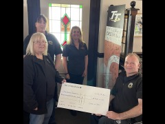 Sandrina hands over a cheque to JDF committee members
