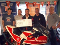 Barry Steels receives the cheque on behalf of the JDF