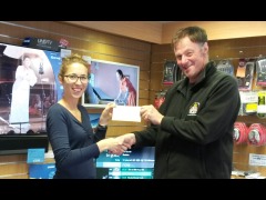 Agnieszka presents a cheque to Kevin